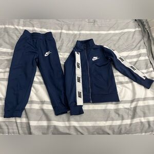 Nike Blue and White striped track suit